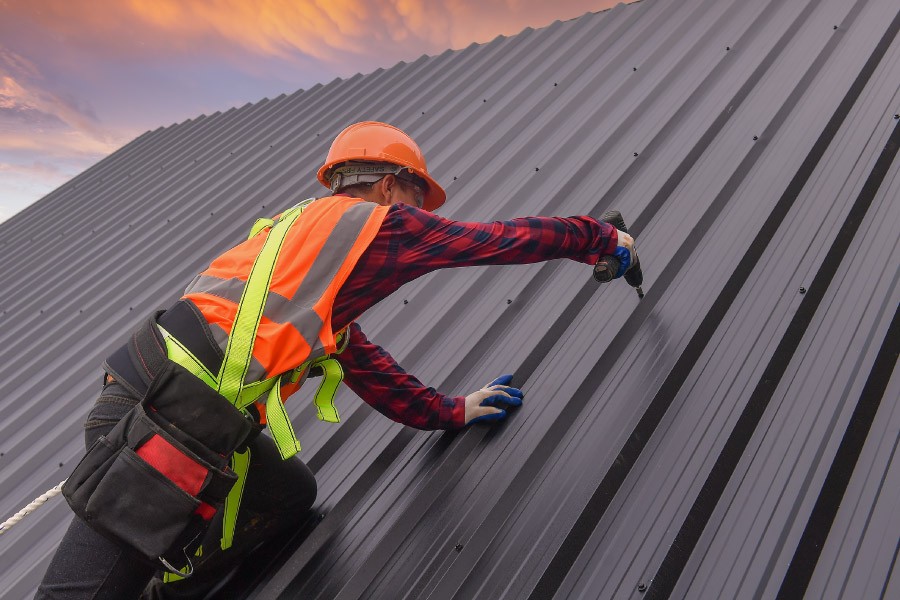 Drilling an exposed screw to metal roof panel