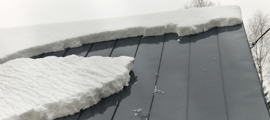 Metal roof with snow easily sliding off, preventing buildup