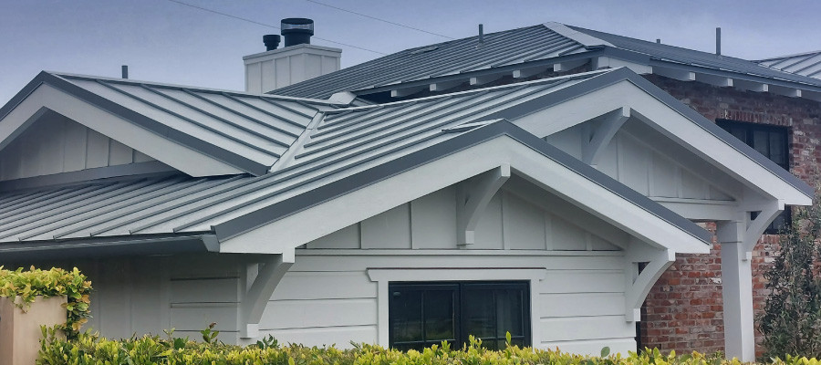 Residential home with metal roofing and siding panels